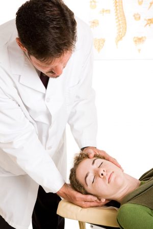 chiropractor adjusting neck for headache