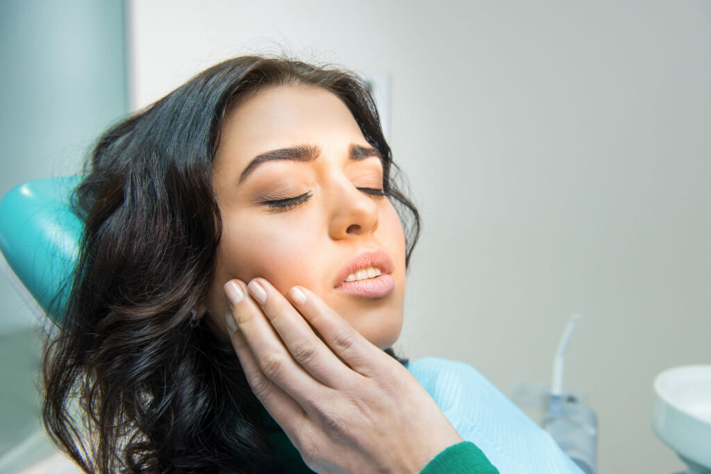 woman experiencing a tooth ache