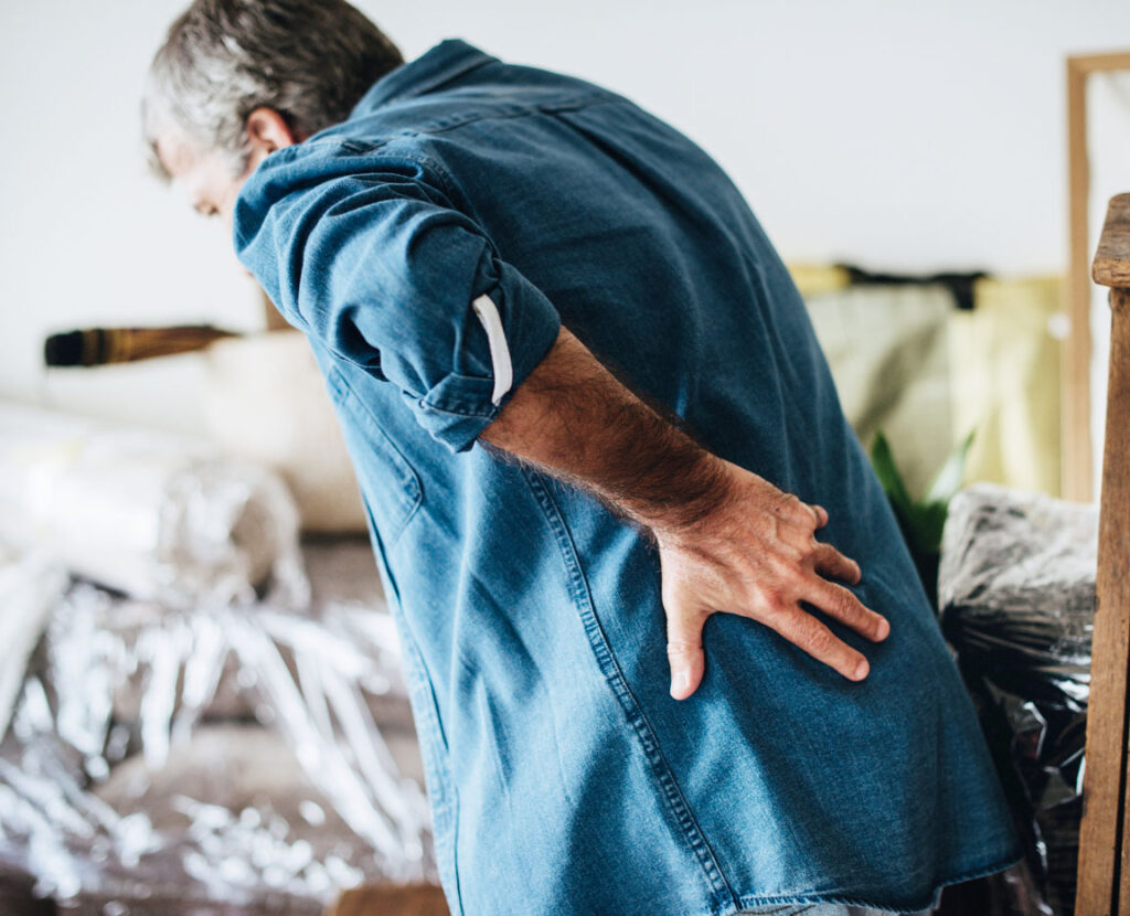 senior male experiencing back pain