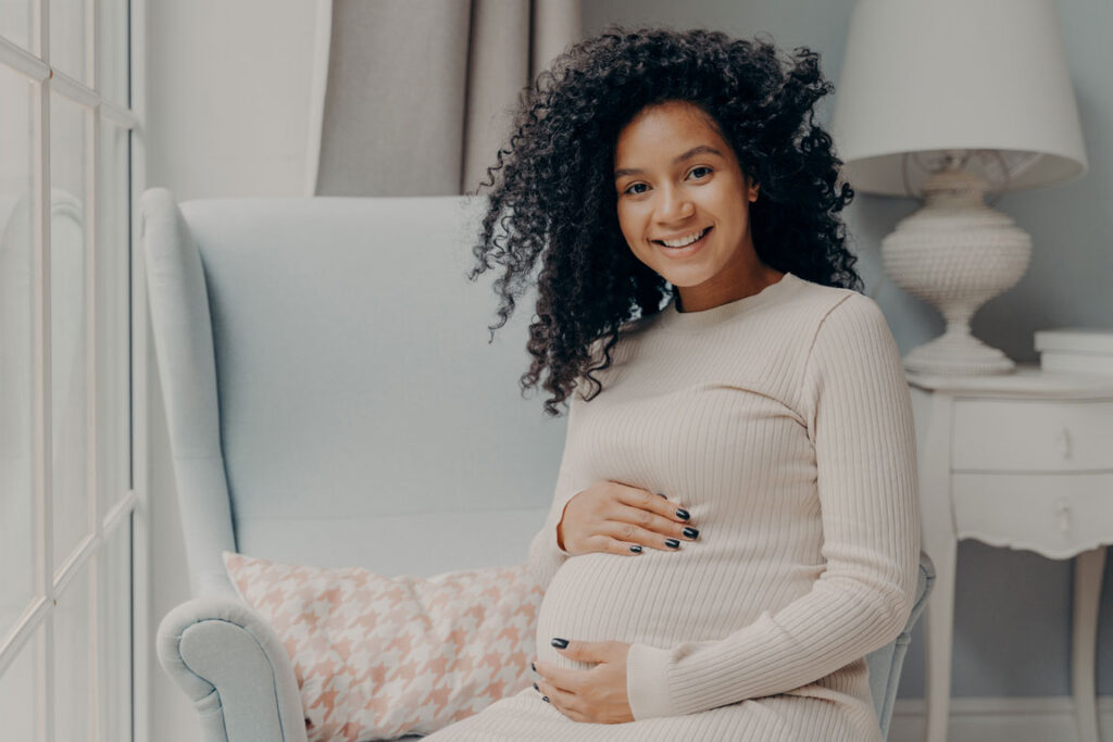 happy African American woman during pregnancy