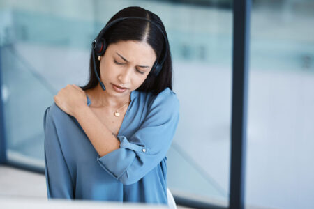 female call center agent experiencing neck pain