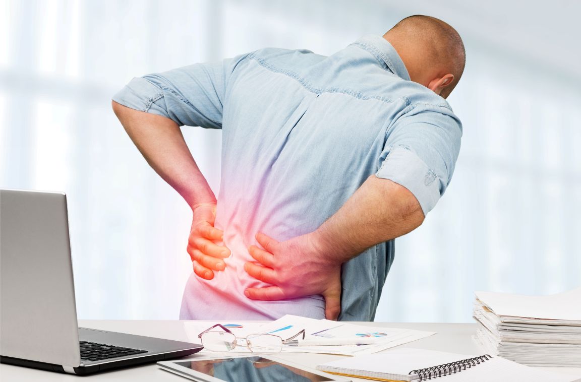 man with signs of low back pain