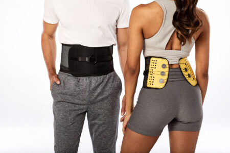 couple wearing the BaxMAX back support brace