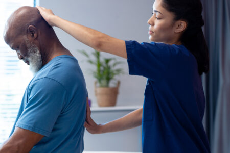 Chiropractor aligning patient's spine